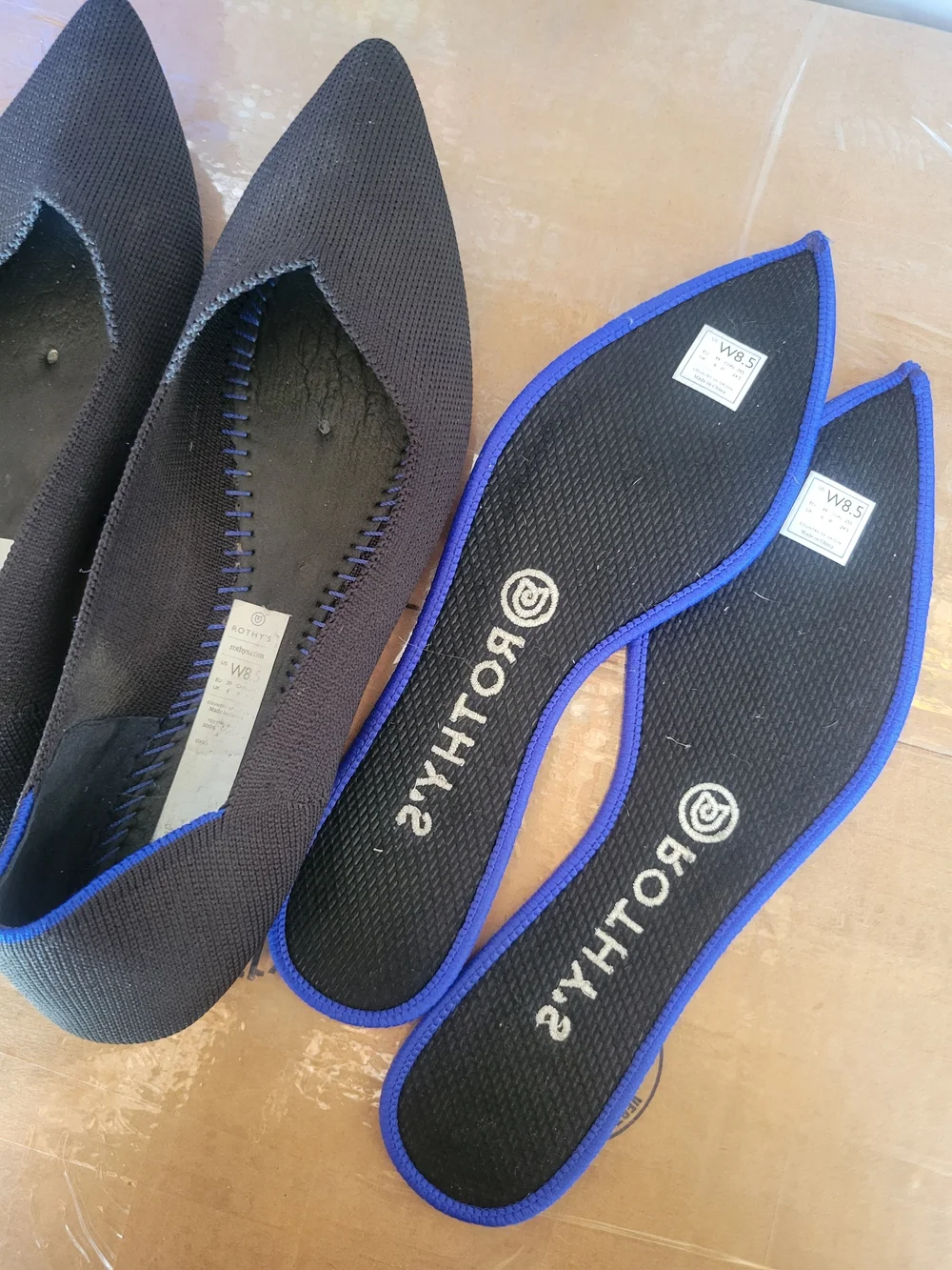 Rothy's Black Pointed Ballet Flat with Blue Trim